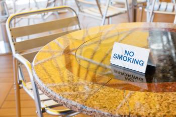 no smoking table in outdoor cafe of cruise liner