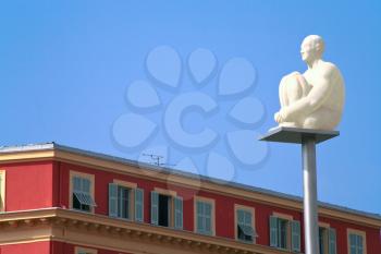 statue of white man with blue sky background in Nice
