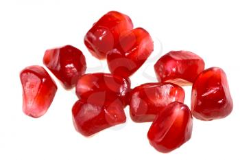 grains of  pomegranate close-up isolated on white