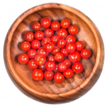 many red cherry tomatoes in wooden bowl