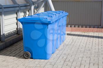 blue plastic recycling bins outdoor