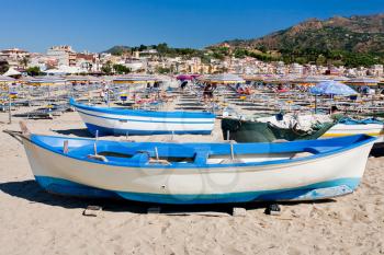 boats on municipal beach Gardini Naxos in summer day, Sicily, Italy