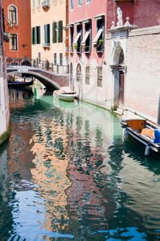 canal, boats and bridge in Venice, Italy