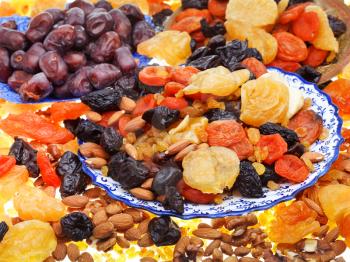 sweet dried fruits on asian plates