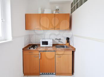 small kitchen with furniture set and kitchen equipment