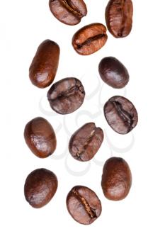 falling roasted coffee beans isolated on white background