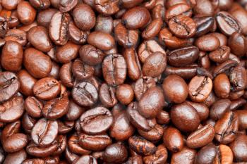 background from many light roasted coffee beans close up