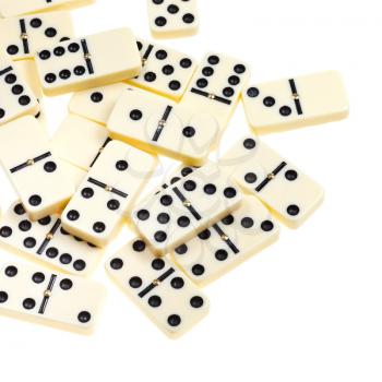 above view of many scattered dominoes isolated on white background