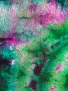 abstract green and magenta ornament of batik painted on silk