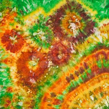 abstract bright floral pattern of painted silk batik on handmade scarf