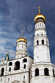 Ivan the Great Bell Tower and Assumption belfry in Moscow Kremlin over storm clouds
