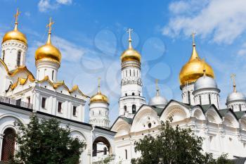 gold domes of white Archangel Cathedral, Annunciation Cathedral and Ivan the great bell tower in Moscow Kremlin