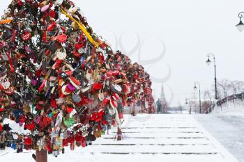 Love Tree with honeymooner locks on Luzhkov bridge in winter, Moscow