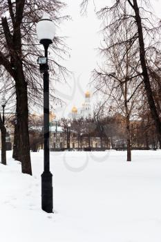view of Ivan the Great Bell Tower from winter urban square, Moscow