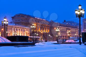 snow in Moscow - snow covered Manege square in winter snowing evening