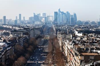 above view of Avenue de la Grande Armee in Paris and la Defense district on background
