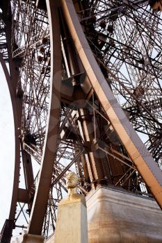 sculpture bust of Eiffel under Eiffel Tower in Paris