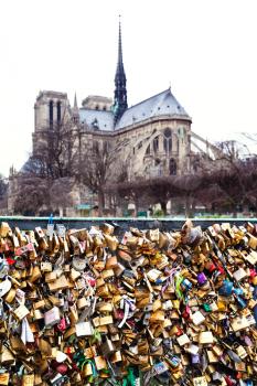 Pont de l'Archeveche with love padlocks and cathedral Notre Dame de Paris