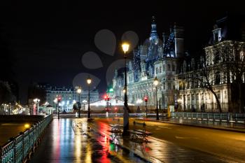 view of Hotel de Ville (City Hall) in Paris, France at rainy night