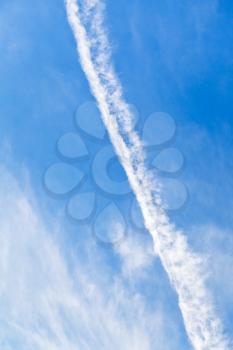 Cloud trace of plane in blue sky