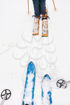 wide cross-country skis and ski run in snow