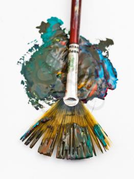 fan paintbrush and blended watercolor paint stain close up