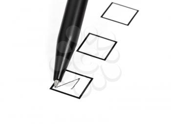 tick in black square box by black ballpoint pen