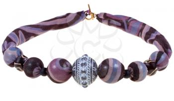 handmade purple and black silk necklace with glass rings isolated on white background