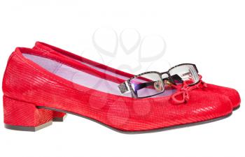 red low heel woman shoes and eyeglasses isolated on white background