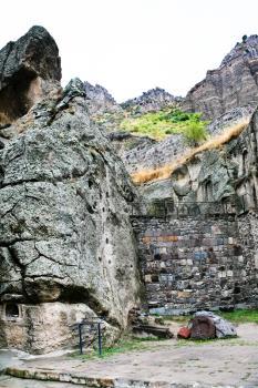 ancient stone walls of medieval geghard monastery in Armenia