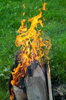 burning boards in outdoor brazier