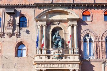 wall statue of medieval palazzo comunale in Bologna, Italy