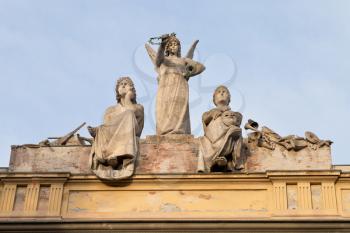 statue on roof of L' Arena del Sole - theater in Bologna , Italy in autumn morning