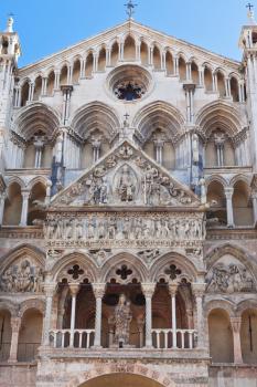 detail of facade of Ferrara Cathedral, Italy