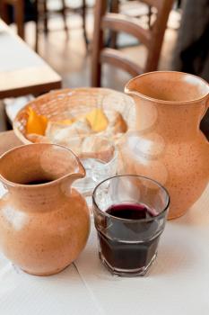 rural ceramic jugs with local red wine and water