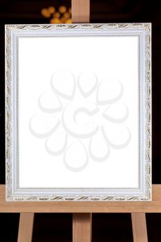 silver wooden picture frame with white cut out canvas
