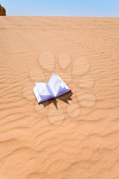 note book on sand dune slope of Wadi Rum desert, Jordan