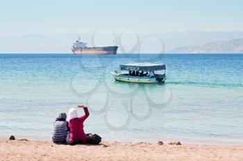 on urban beach in Aqaba town, view on Aqaba gulf