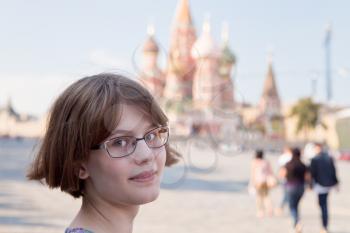 teenager girl in glasses on Red Square in Moscow