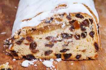 sliced Stollen cake with dried fruit and marzipan close up