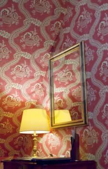 yellow retro lamp and red vintage silk wallpaper