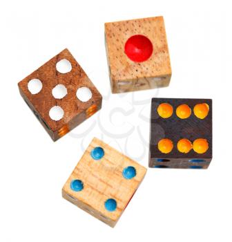 top view of four wooden gambling dices close up isolated on white background