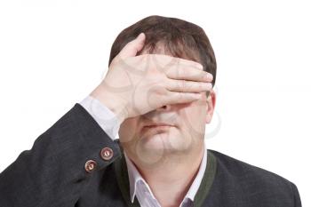 businessman closed his eyes by hand - hand gesture isolated on white background