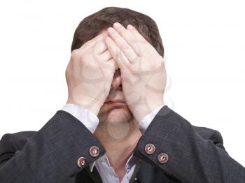 businessman closed his eyes and sees nothing - hand gesture isolated on white background