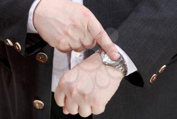 businessman show exact time on wristwatch close up - hand gesture
