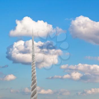rope rises to little white cloud in blue sky