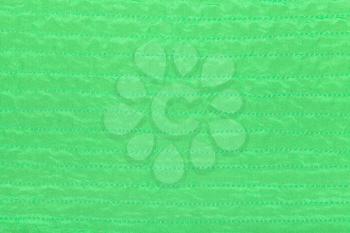 green color textile texture of stitched silk fabric