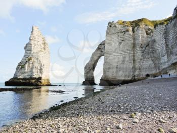 view of cliffs with arch on english channel beach of Etretat cote d'albatre, France