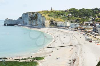 view of Etretat resort town on english channel beach of cote d'albatre, France