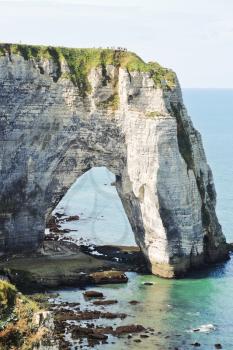 view of rock with arch on english channel beach of Etretat cote d'albatre, France